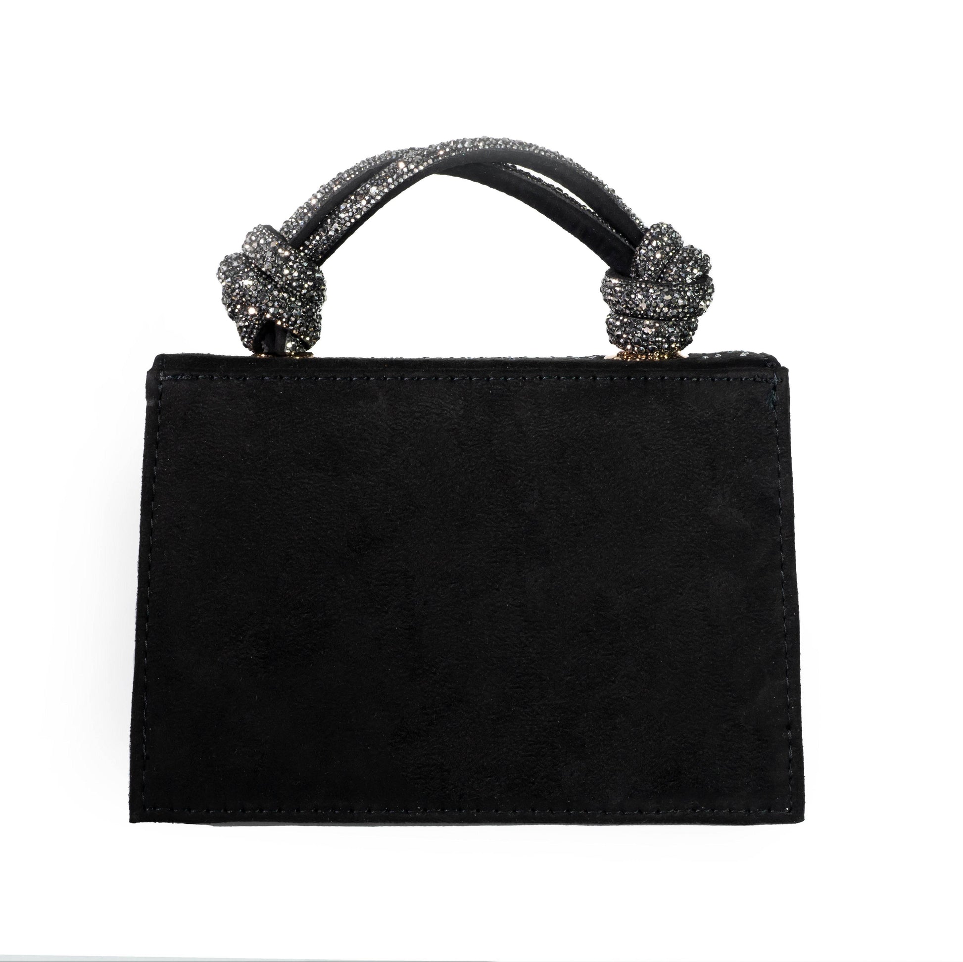 Black handbag with decorative handles on a white background