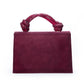 Maroon handbag with decorative handle on a white background