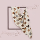 Polka dot scarf on a pink background