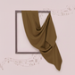 Brown fabric draped over a black frame on a light pink background with musical notes.