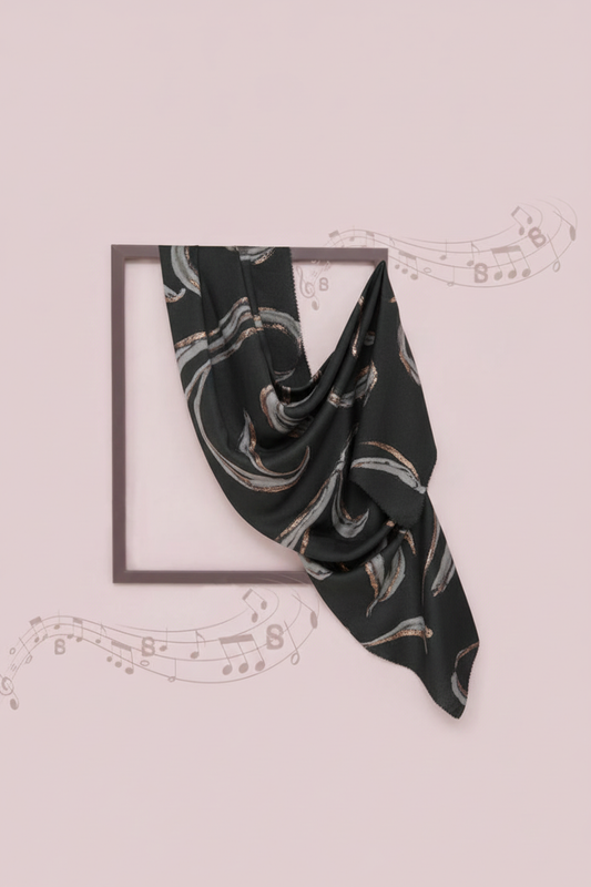 Black scarf with white patterns on a light pink background