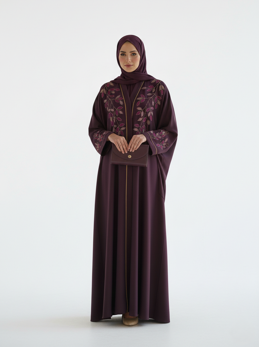 Woman wearing a dark purple abaya with a matching hijab on a white background