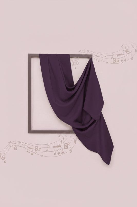 Purple fabric draped over a black frame on a light pink background