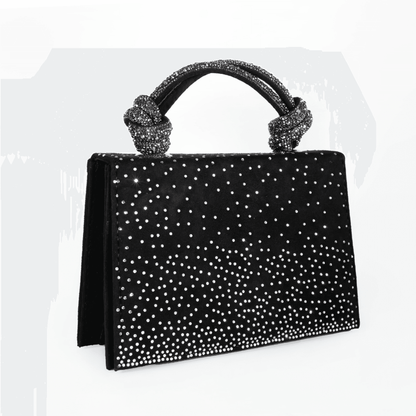 Black handbag with silver studs on a white background